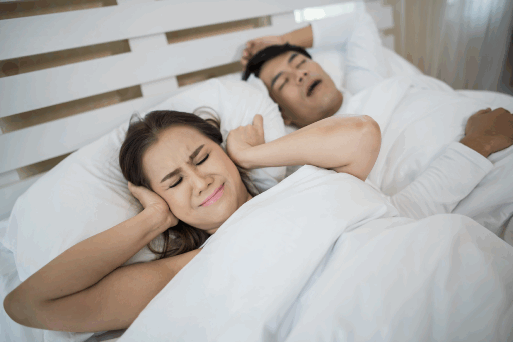 Man struggling to sleep due to sleep apnea symptoms