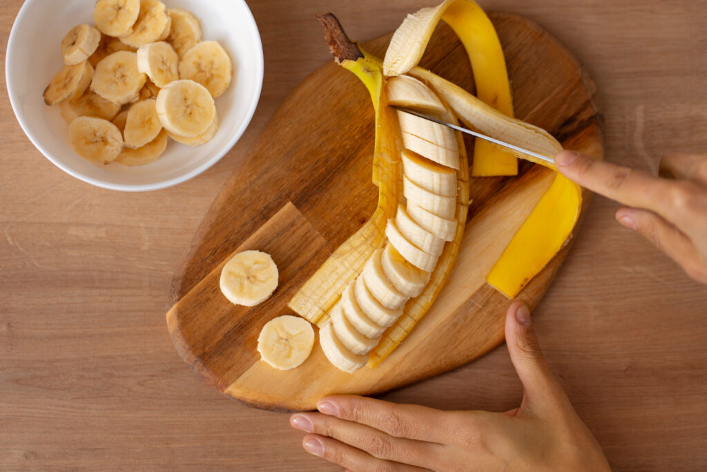 Bananas Making You Fat? The Shocking Truth About Calories & Carbs Banana slices in a bowl showing calories and nutrition facts
