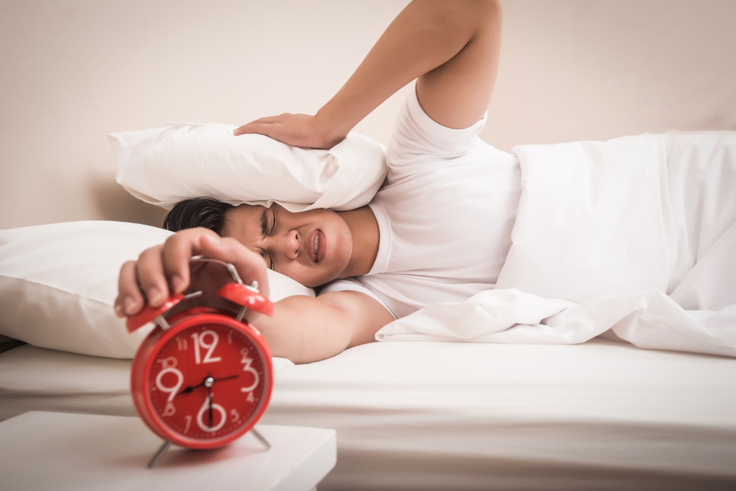 Person waking up late showing oversleeping symptoms