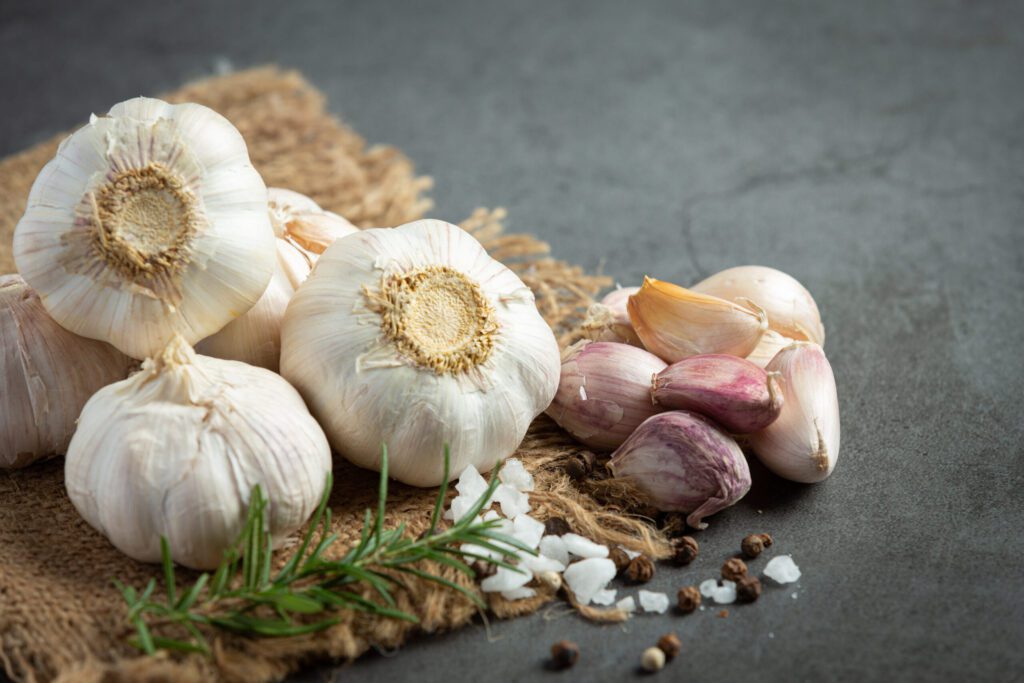 Fresh garlic bulbs highlighting garlic benefits for health