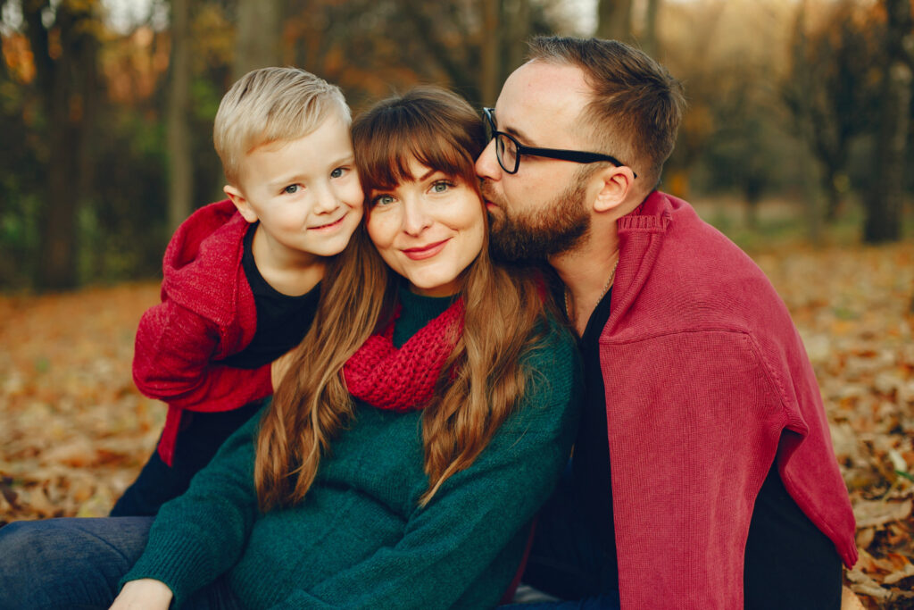 Parents with child holding hands, symbolizing co-parenting harmony