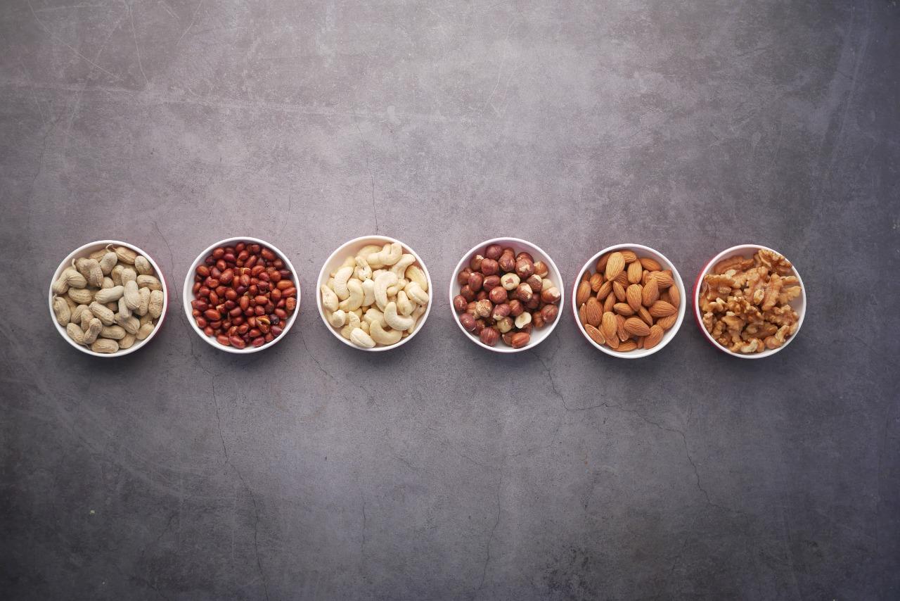 Bowl of soaked almonds, nuts and dryfruits showing health benefits