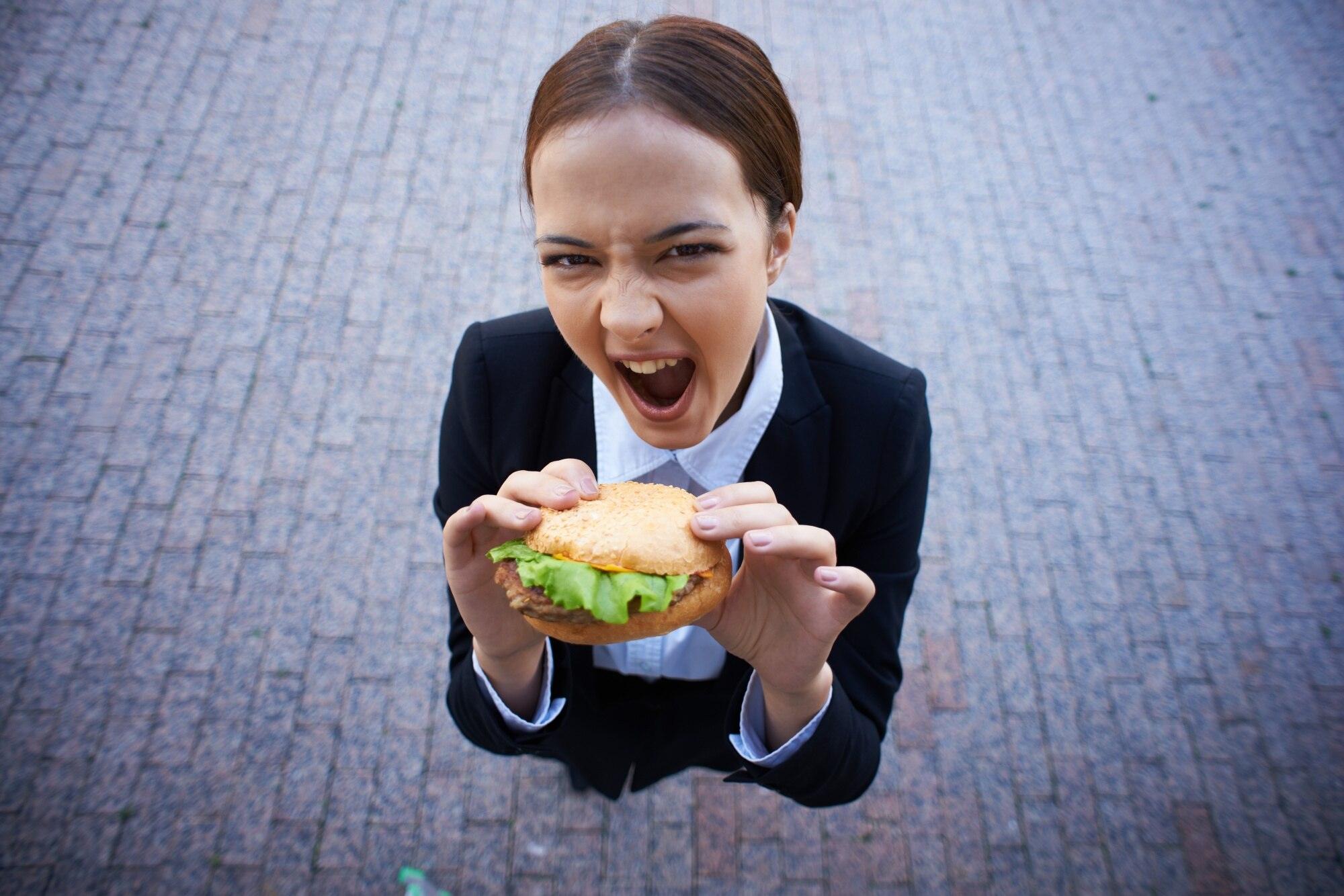 Person holding dessert symbolising craving for sweets