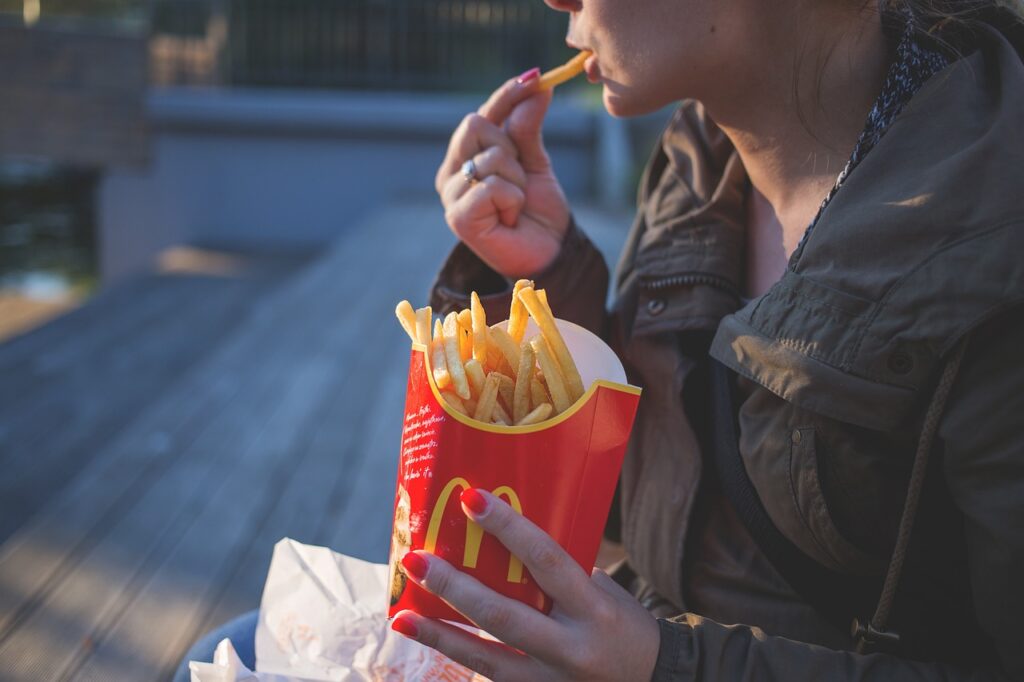 From Picky Eaters to Healthy: Shift Your Child’s Food Preferences Child eating junk food