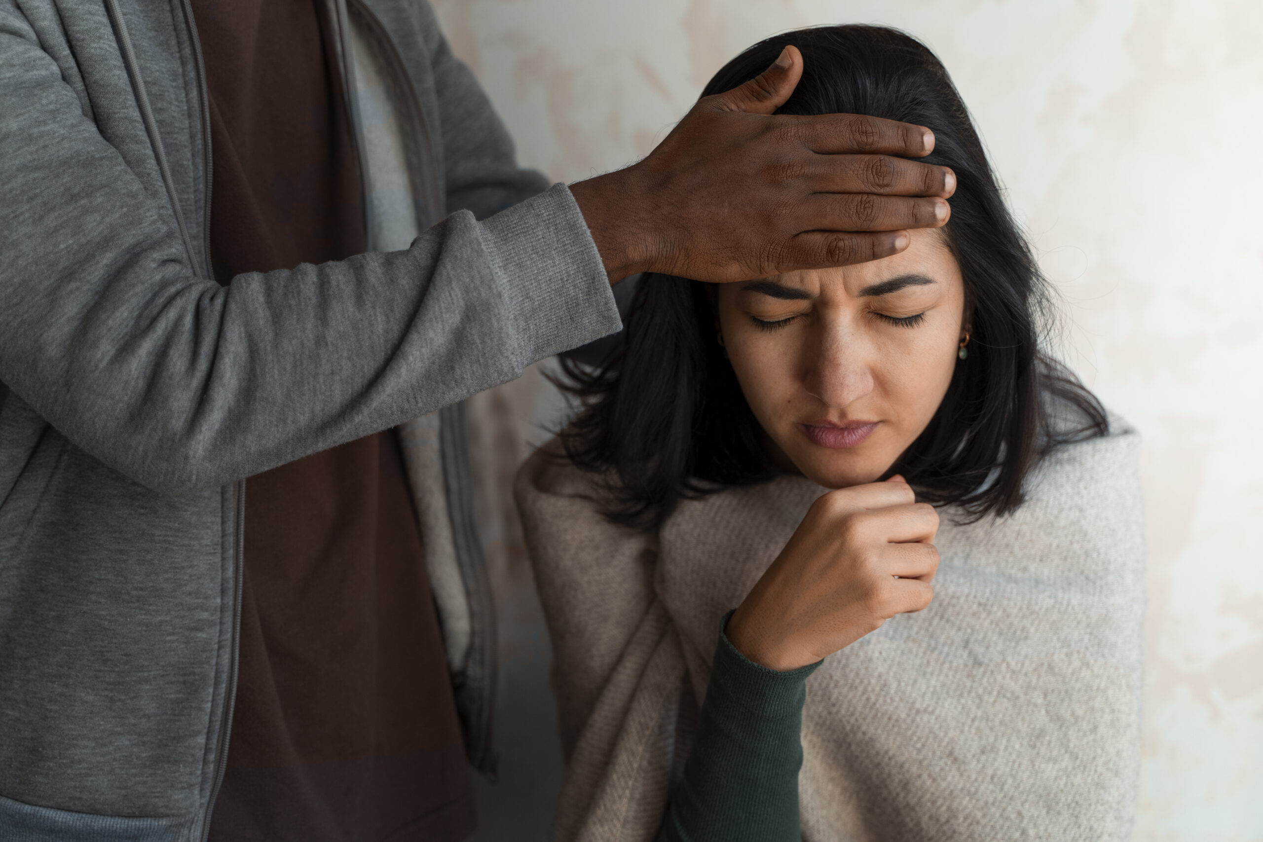 Managing Compassion Fatigue: A Gentle Guide for Every Caregiver Who’s Tired but Still Showing Up Healthcare worker looking exhausted after a long shift, reflecting caregiver stress