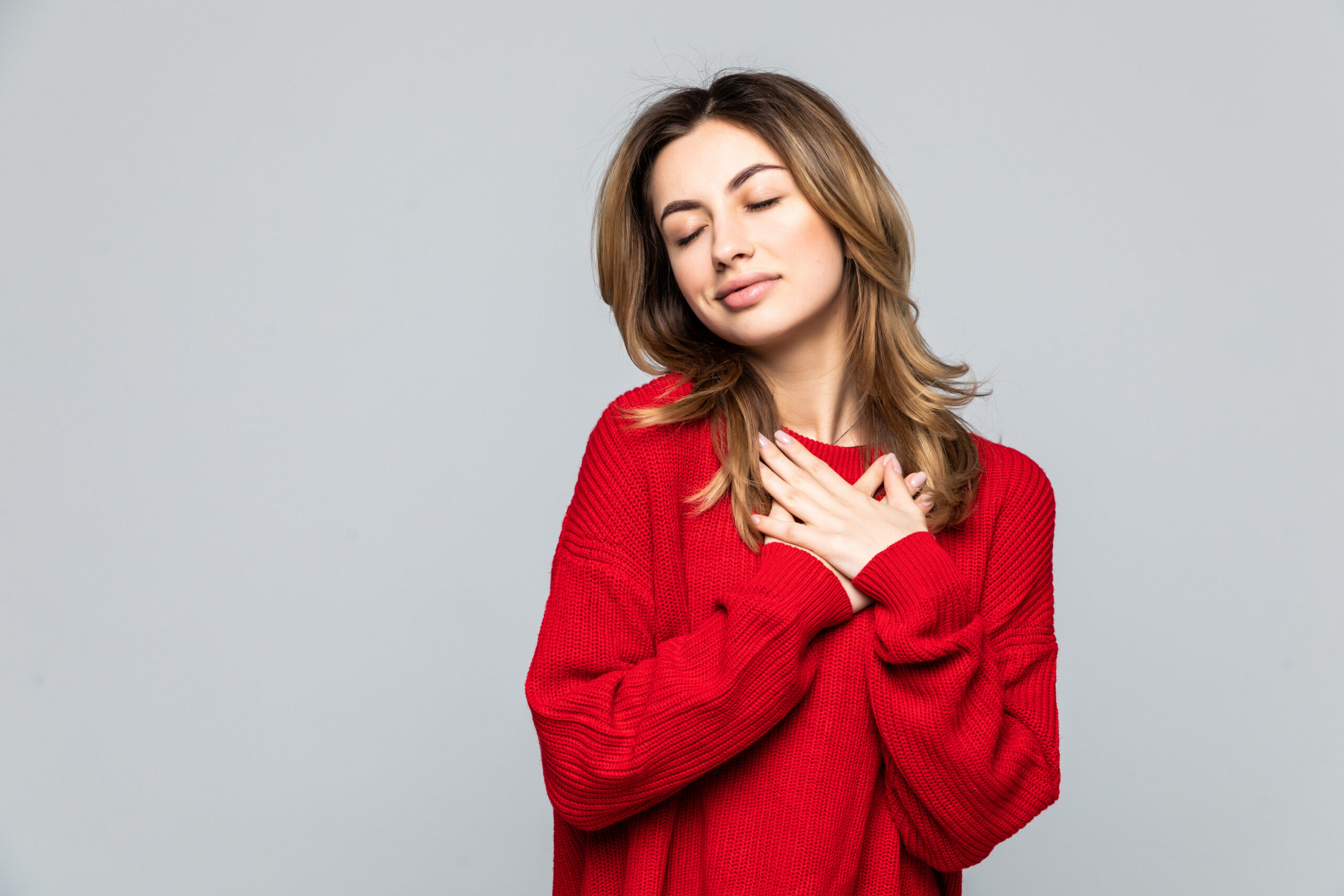 Managing Compassion Fatigue: A Gentle Guide for Every Caregiver Who’s Tired but Still Showing Up Tired caregiver resting with hand on heart symbolizing compassion fatigue