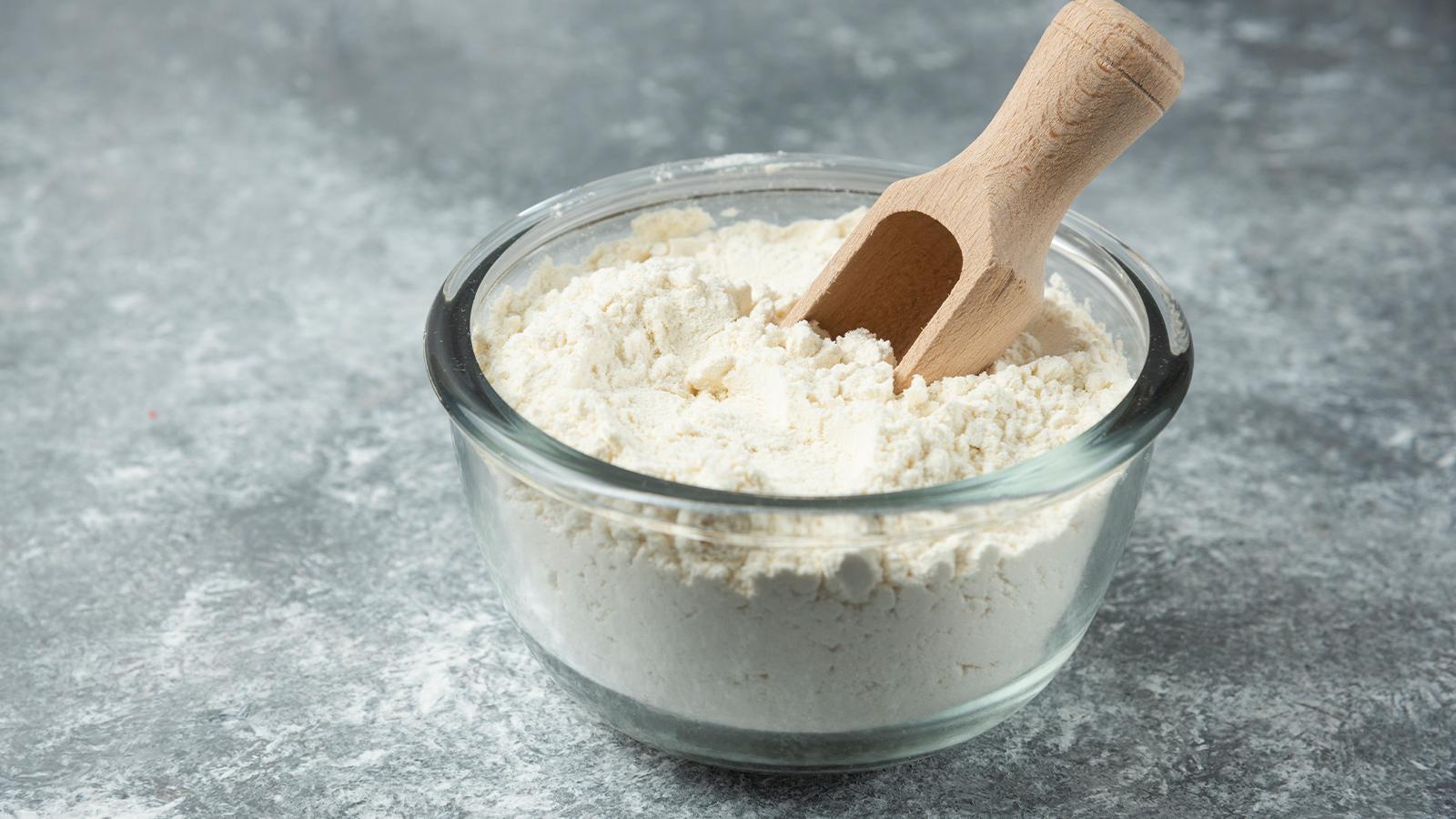 Bowl of sattu protein powder placed on a wooden table representing a benefits.